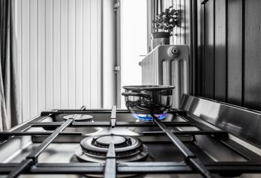 Small metal pan on the stove in the kitchen A small metal pan on the stove in the kitchen